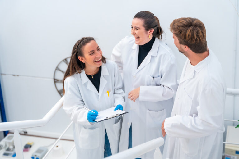 Happy doctors working in a nano cell technological laboratory